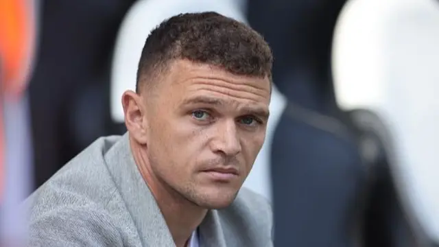 Kieran Trippier sat in the Newcastle United dugout