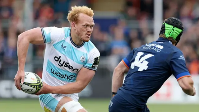 Miles Reid of Bath, runs with the ball while under pressure from Darcy Graham of Edinburgh Rugby during the EPCR Challenge Cup semi-final