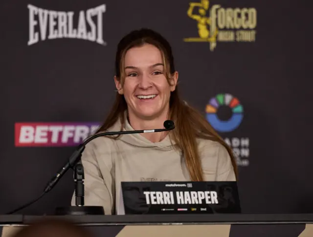 Terri Harper smiling at the news conference