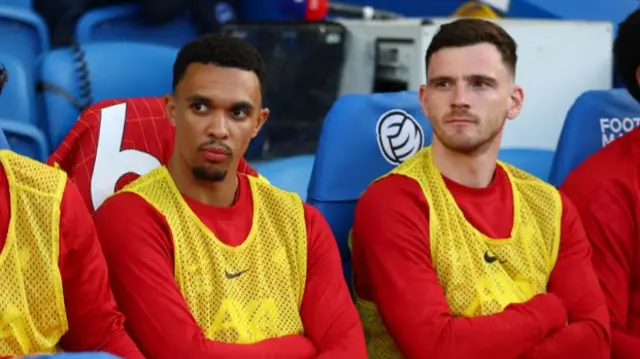 Trent Alexander-Arnold and Andy Robertson sat on the Liverpool bench for a game at Brighton
