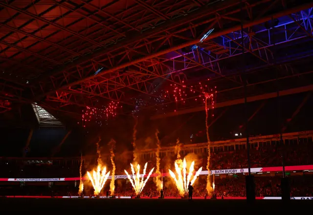 General view during a pyrotechnics display inside the stadium before the match