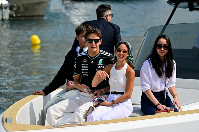 George Russell and his girlfriend Carmen arrive in Monaco by boat