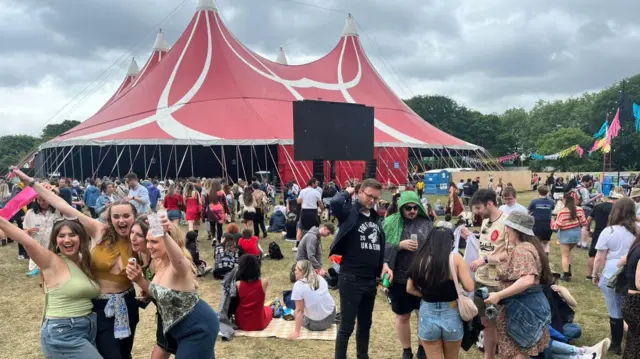 crowds gather in front of the new music tent