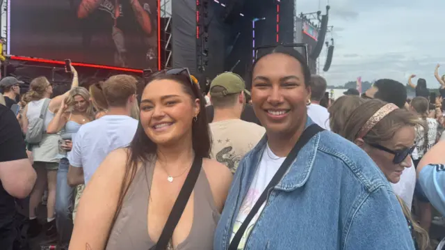 Laura and Alice stand in front of the crowd for the Sugababes
