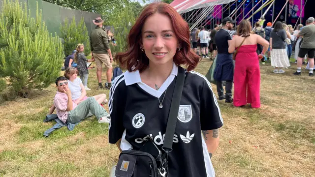 Morgan Beckers smiles for the camera at Big Weekend. She has ginger hair and blue eyes.