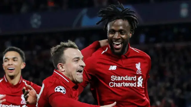 Origi celebrates scoring their fourth goal with Xherdan Shaqiri and Trent Alexander-Arnold