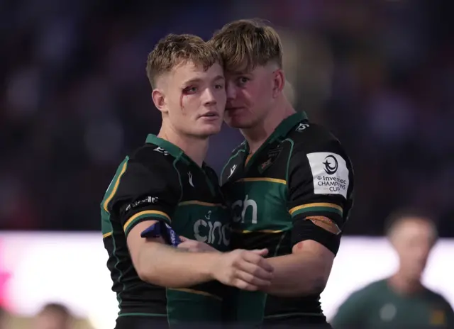 Fin Smith has a heavy cut on his eye and Henry Pollock looks gutted.