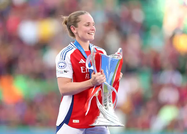 Kim Little of Arsenal prepares to lift the UEFA Women's Champions League trophy