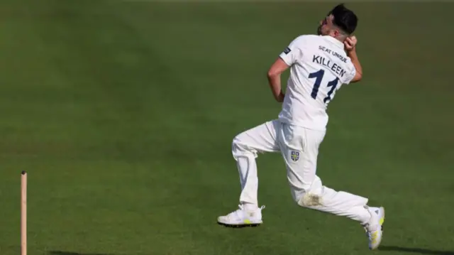 Mitchell Killeen in his delivery stride about the release the ball