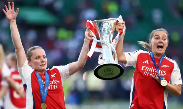 Little and Pelova lift the trophy