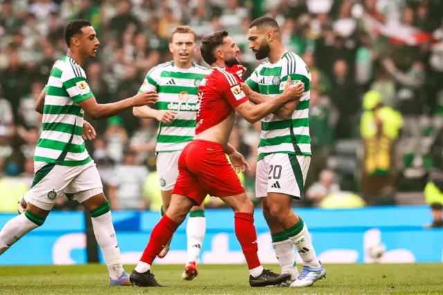 Aberdeen Captain Graeme Shinnie and Celtic's Cameron Carter-Vickers clash