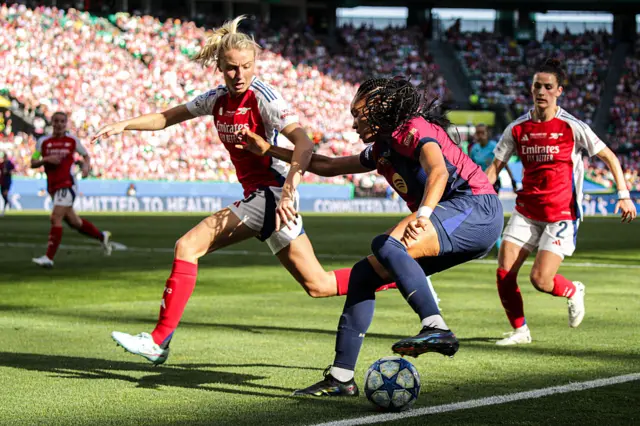 Salma tries to dribble past Williamson and Fox
