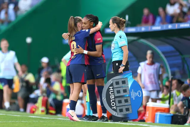 Pina and Salma embrace as they swap places on the pitch