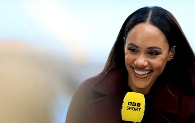 BBC Sport presenter, Alex Scott looks on