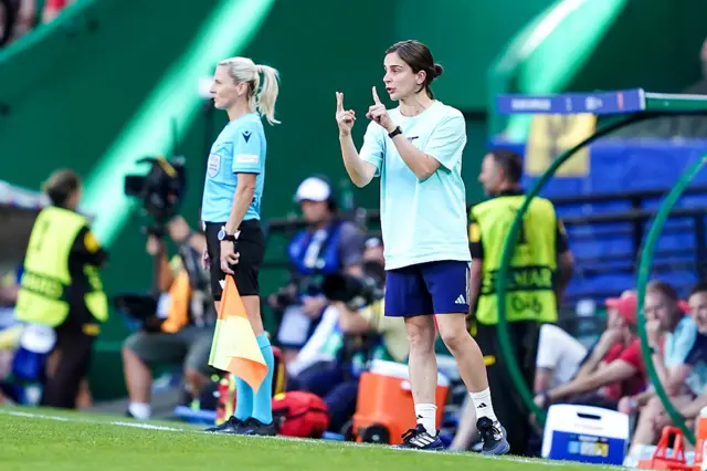 Slegers gives instructions from her technical area