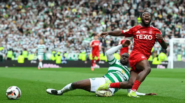 Aberdeen's Shayden Morris and Celtic's Jeffrey Schlupp in action