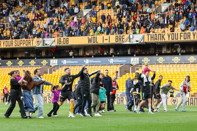 Vitor Pereira, manager of Wolverhampton Wanderers, leads players and families in his customary demonstration of gratitude to the supporters
