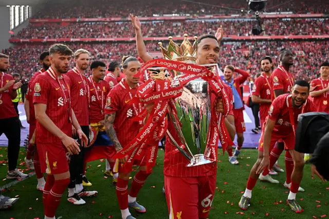 Trent Alexander-Arnold celebrates with the Premier League trophy