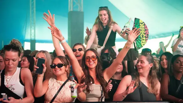 Several women at the front of the crowd at Radio 1's Big Weekend