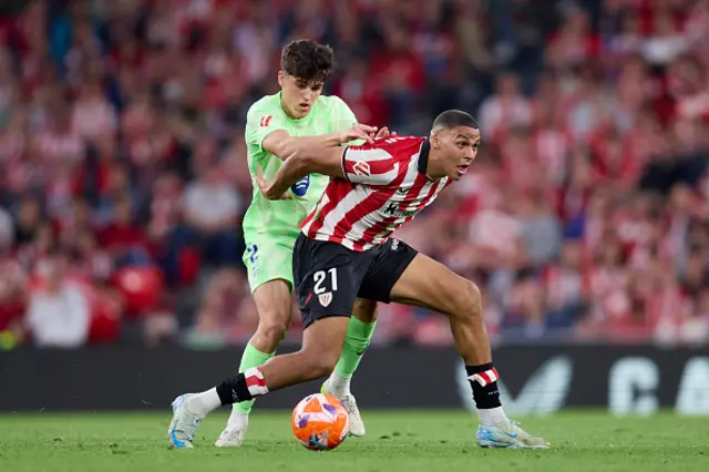 Pau Cubarsi of FC Barcelona battles for possession with Maroan Sannadi