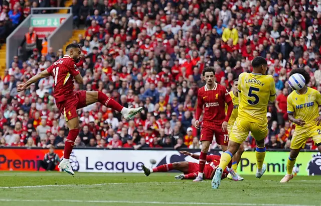 Liverpool's Mohamed Salah scores their side's first goal