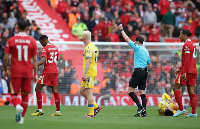 Liverpool's Ryan Gravenberch is shown a red card