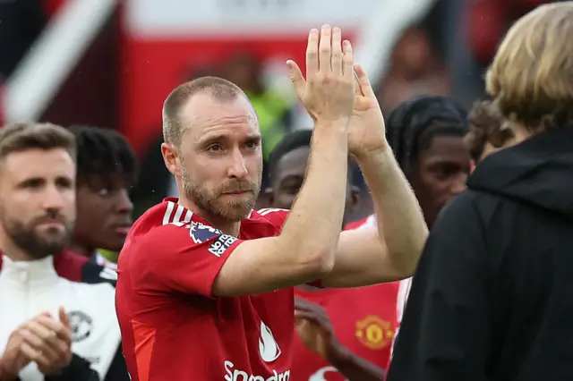 Manchester United's Danish midfielder #14 Christian Eriksen applauds supporters
