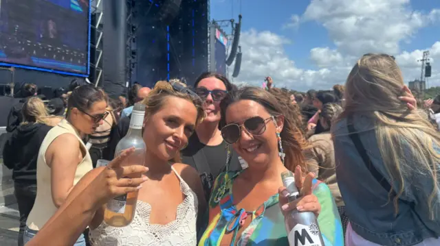 Three women at a music festival