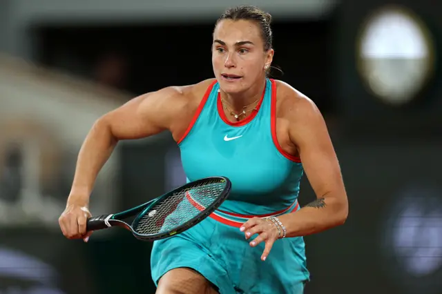 Aryna Sabalenka runs to meet a drop shot