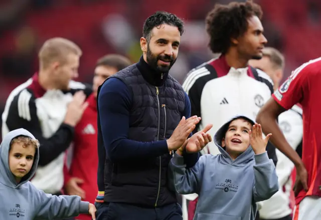 Manchester United manager Ruben Amorim (centre) after the Premier League match at Old Trafford, Manchester.