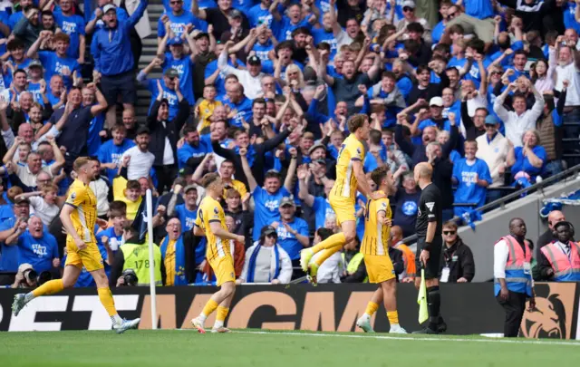 Brighton and Hove Albion's Jack Hinshelwood (right) celebrates with his team mates after