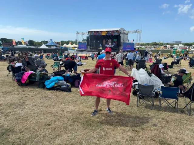 Man wearing at Liverpool shirt at a music festival