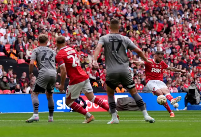 Charlton Athletic's Macaulay Gillesphey (right) score his sides first goal from a direct free kick
