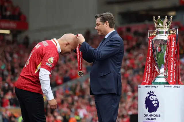 Arne Slot, Manger of Liverpool, is presented with his Premier League Winners Medal by Richard Masters, Chief Executive Officer (CEO) of the Premier League