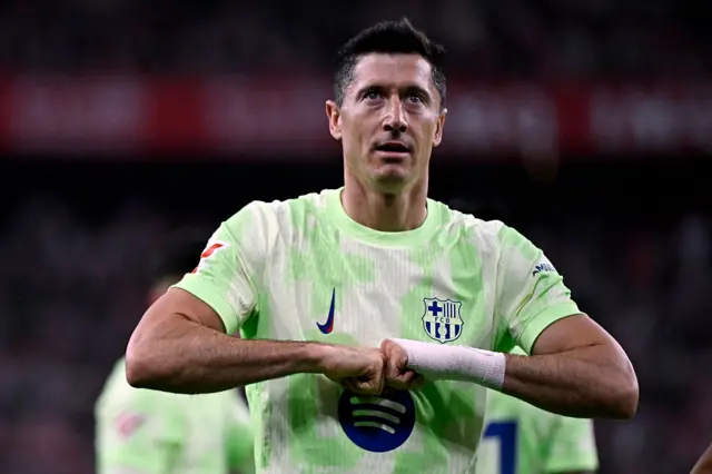 Robert Lewandowski celebrates scoring the opening goal