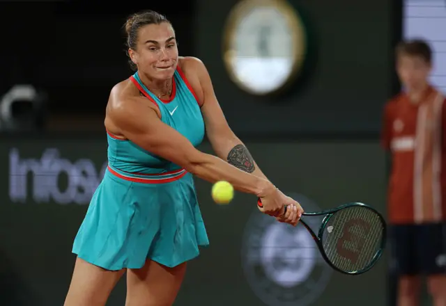 Aryna Sabalenka hits a backhand