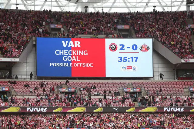 The display shows during a VAR check at Wembley