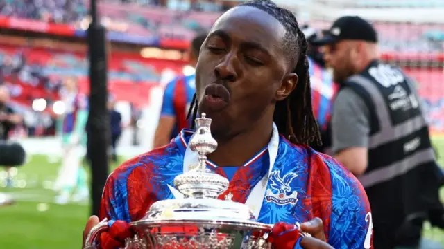Eberechi Eze holding the FA Cup
