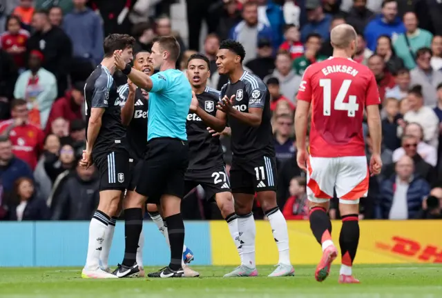 Aston Villa's Morgan Rogers (centre right) and team-mates react after referee Thomas Bramall disallows his goal during the Premier League match at Old Trafford, Manchester.