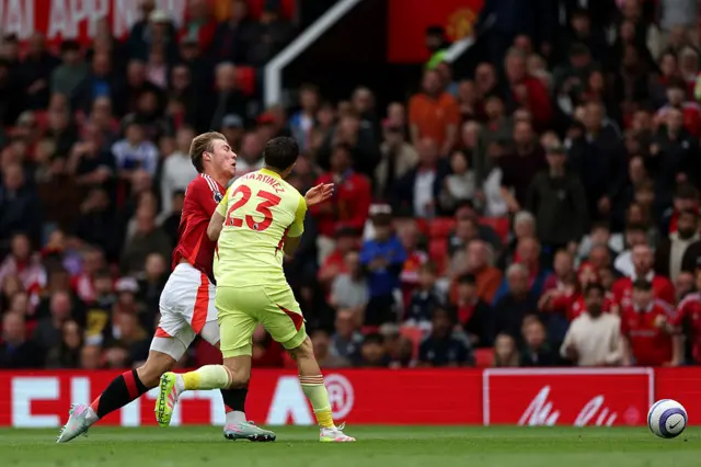 Rasmus Hojlund of Manchester United is fouled by Emiliano Martinez of Aston Villa, resulting in a red card