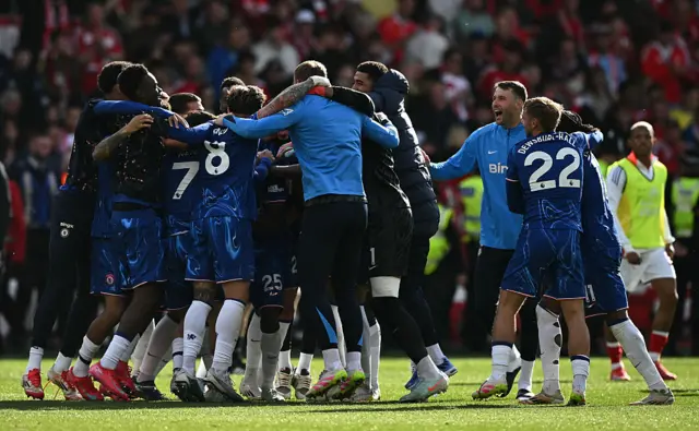 Chelsea players react at the final whistle during the English Premier League football match between Nottingham Forest and Chelsea at The City Ground in Nottingham,