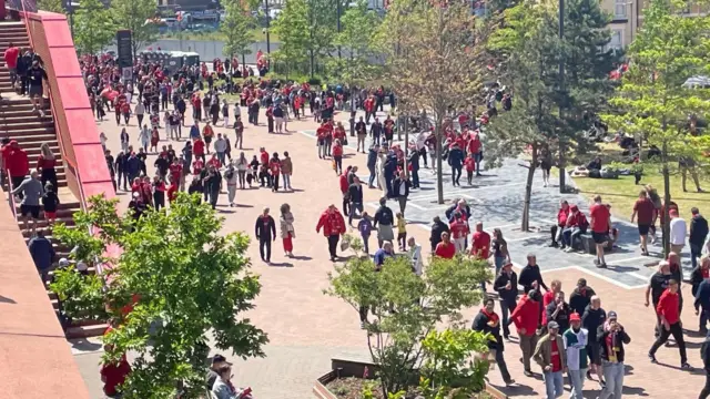 Crowds gathering for the arrival of the team bus
