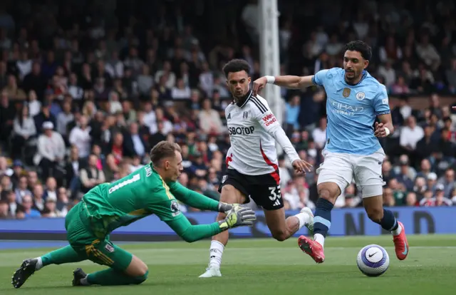 Manchester City's Omar Marmoush in action with Fulham's Bernd Leno and Antonee Robinson
