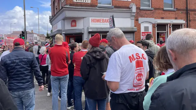 A queue for a pie shop