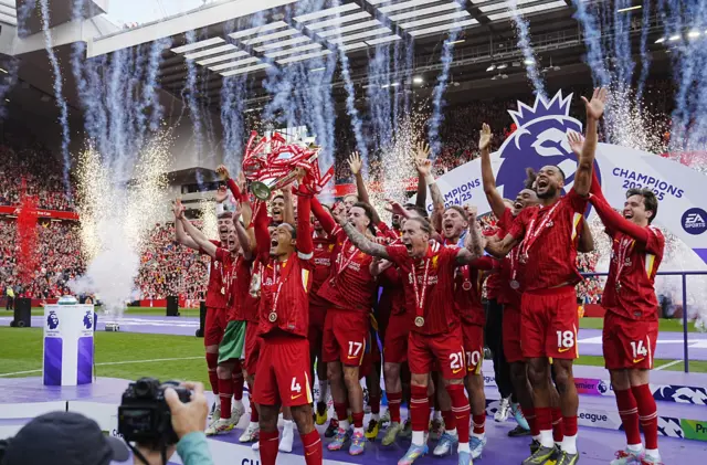 Virgil van Dijk lifts the 2024-25 Premier League trophy with his Liverpool team-mates