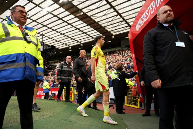 Emiliano Martinez of Aston Villa walks down the tunnel