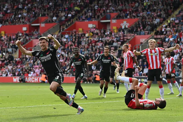 Arsenal's Scottish defender #03 Kieran Tierney (L) celebrates after scoring a goal