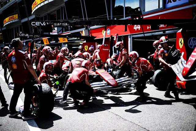 The Ferrari crew practise a pit stop in Monaco