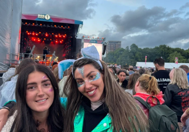 Izzy and Rebecca in the crowd in front of the Main Stage