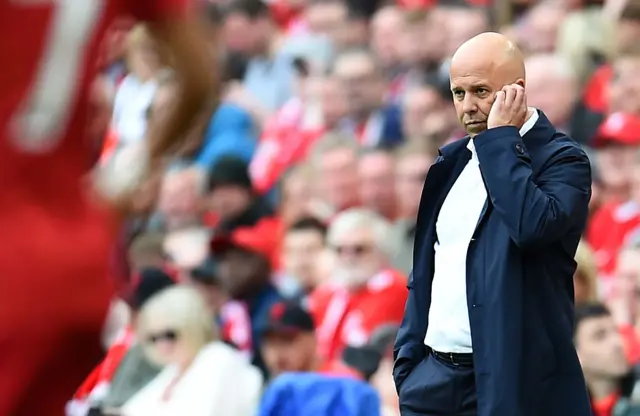 Liverpool manager Arne Slo watches from the touchline